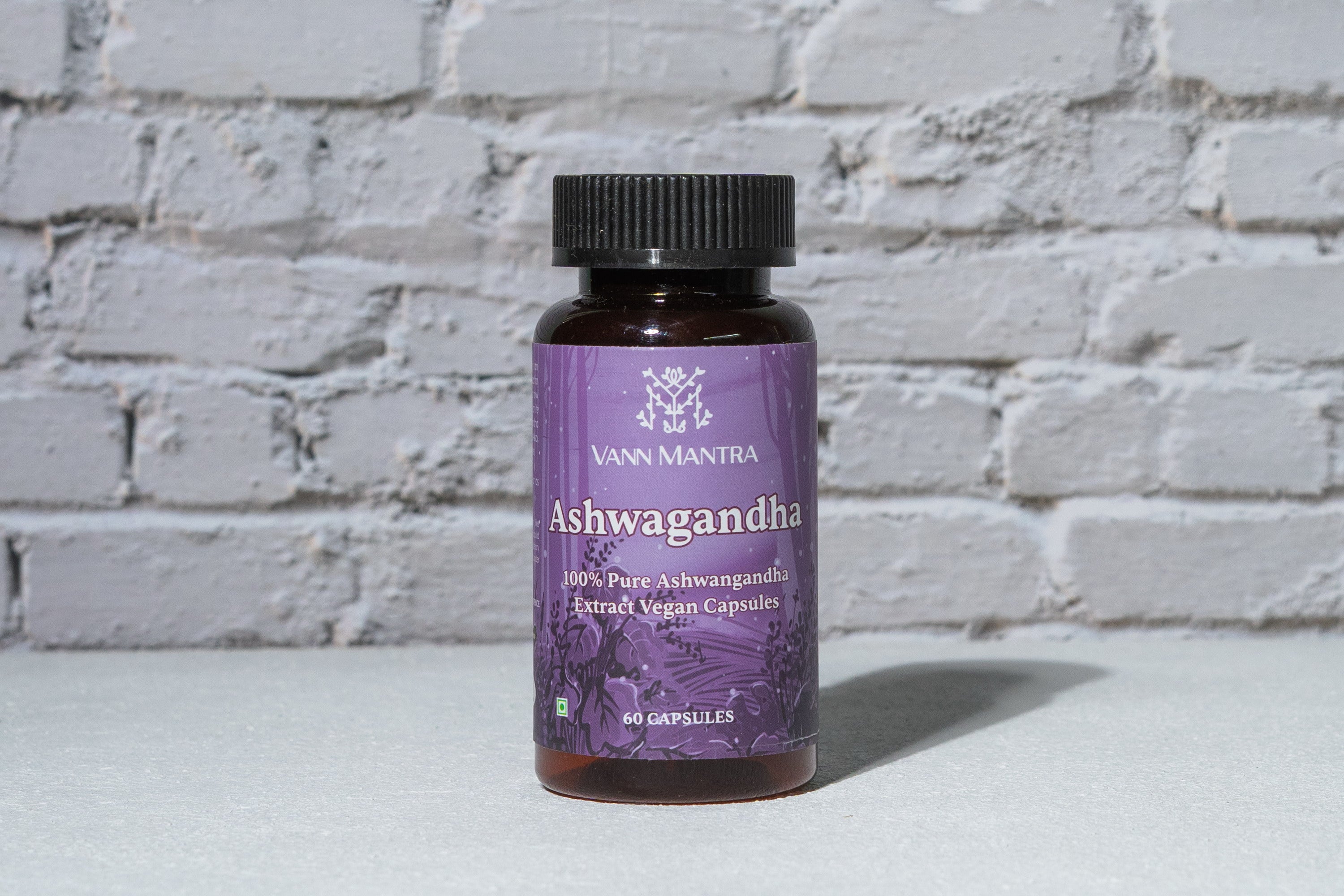 Ashwagandha Capsule in front of a brick wall 