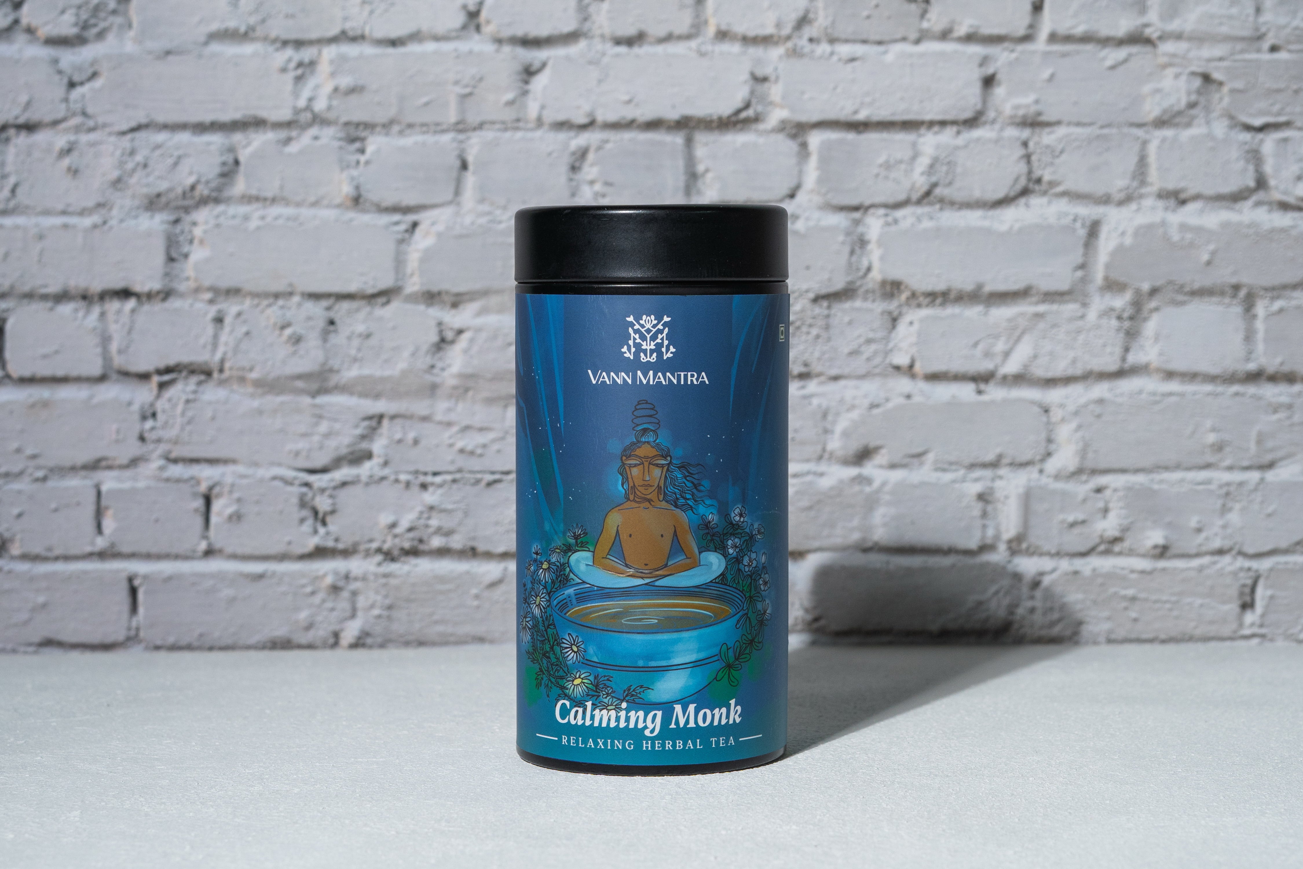 Calming Monk Tea in front of a brick wall 
