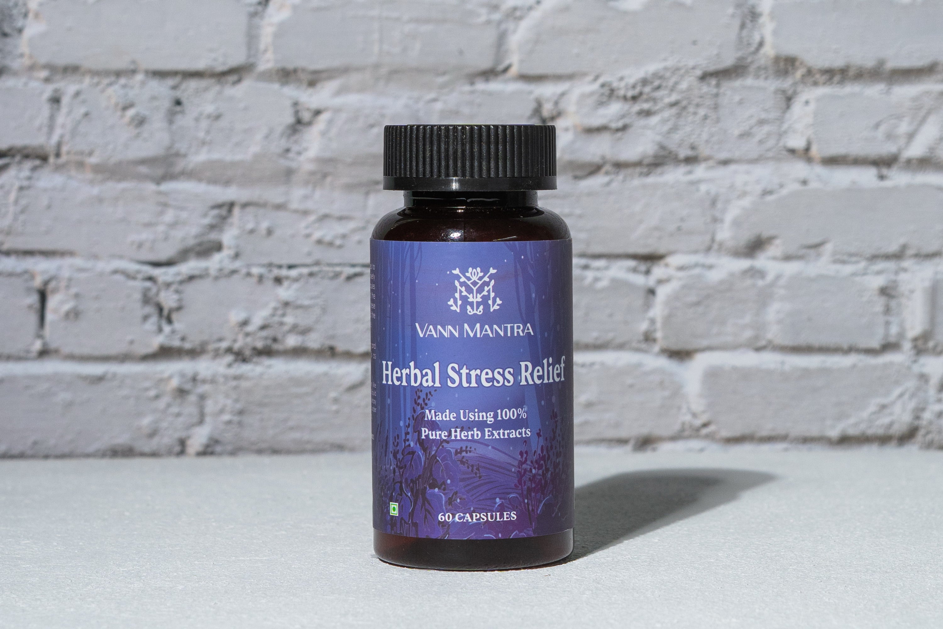 Herbal Stress Relief Capsules in front of a brick wall 