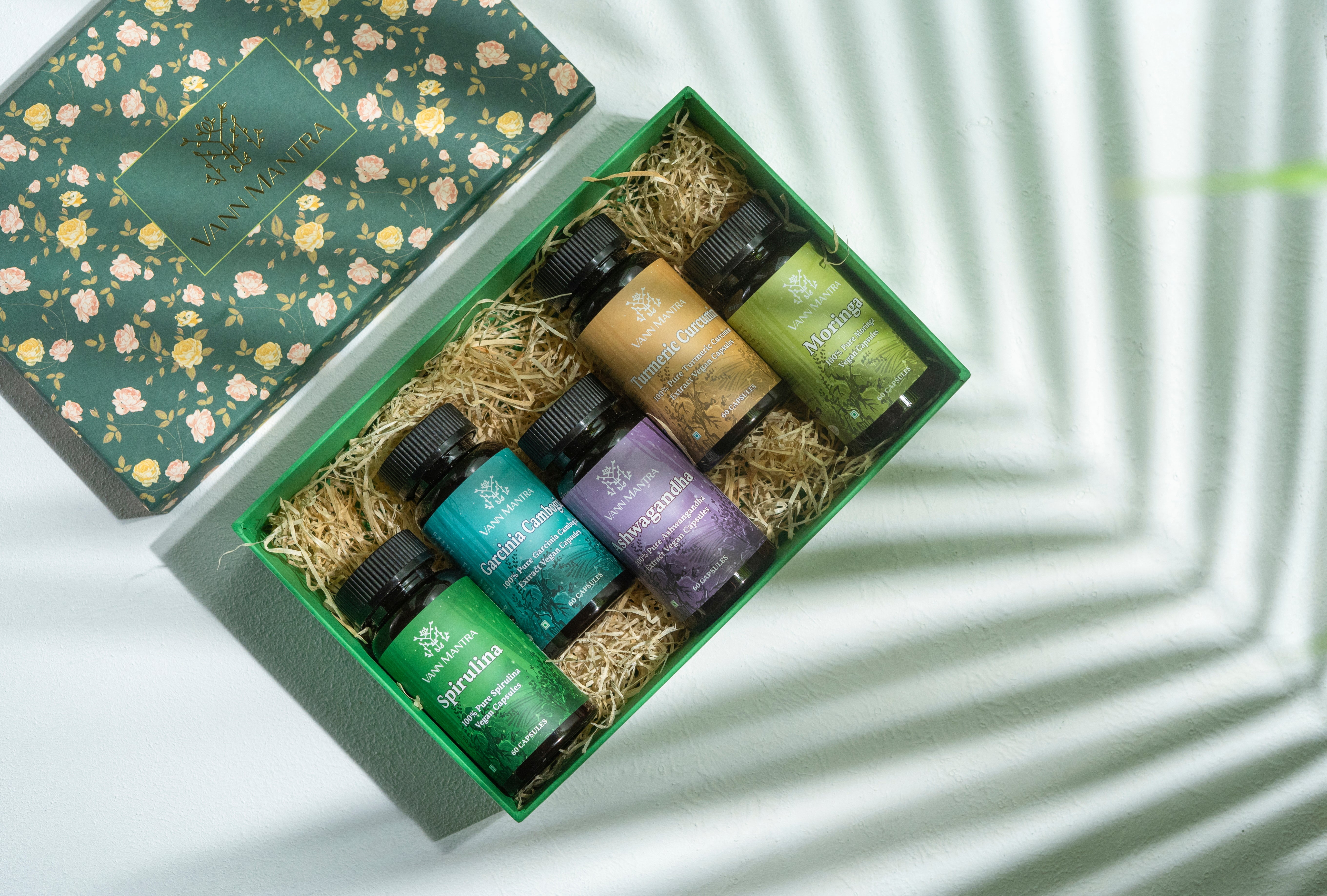 Box Of Nature's Love on a backdrop with plants
