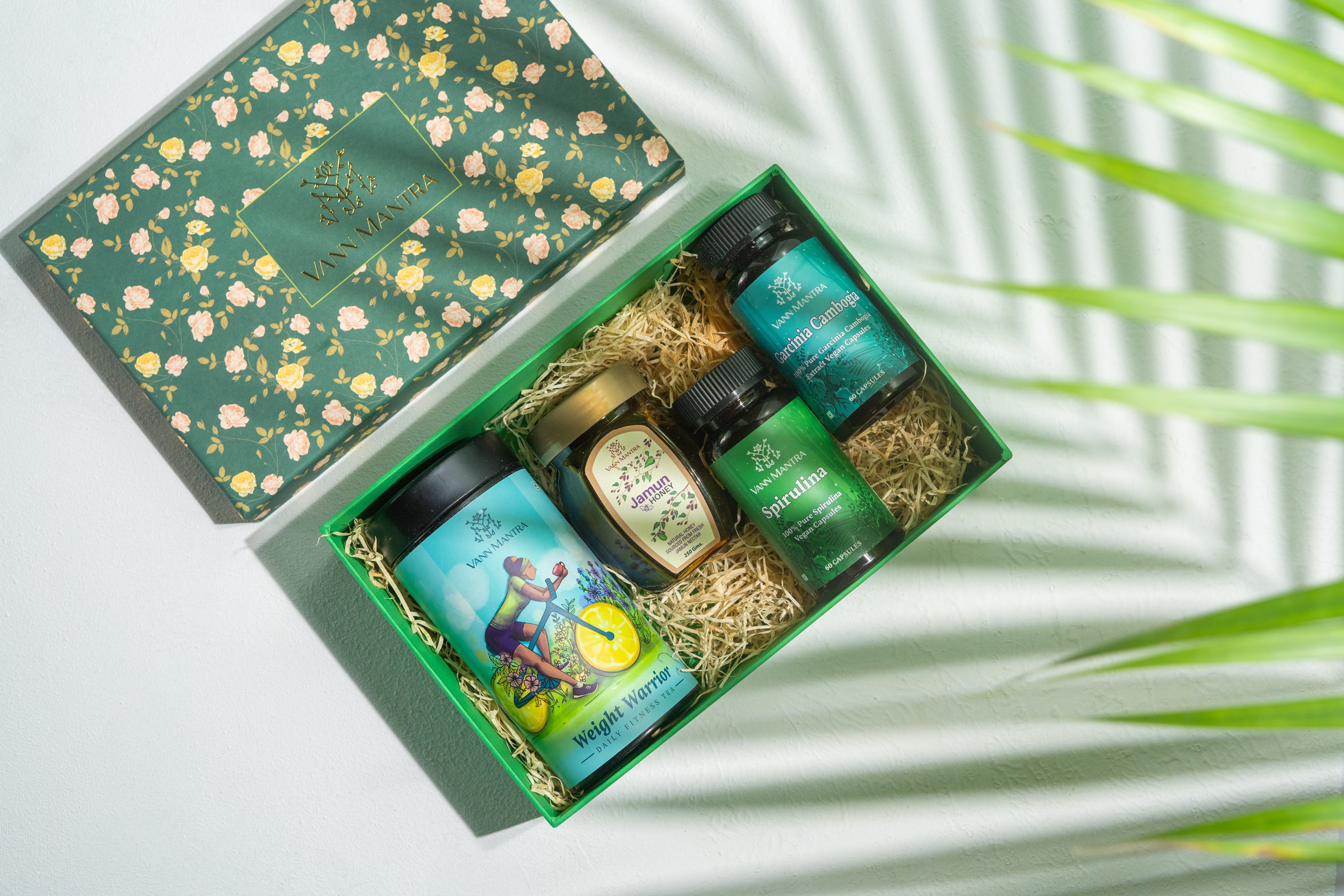 Box Of Weight Management on a backdrop with plants